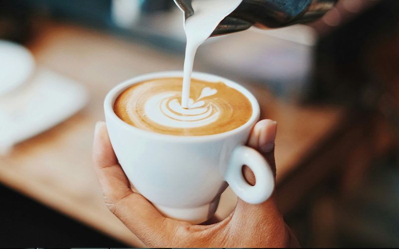 Fresh coffee beans in roasting process